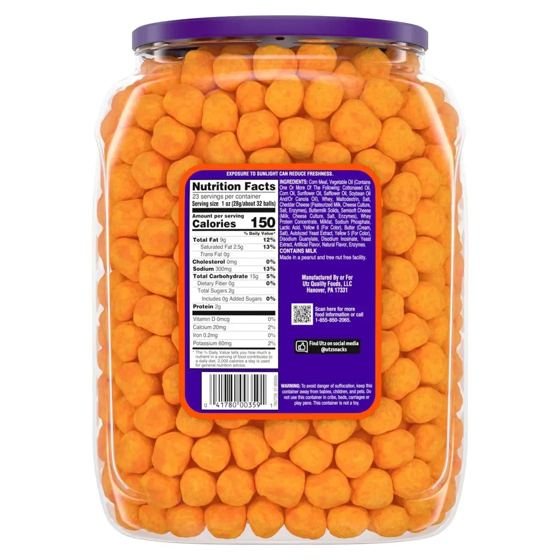Jar of orange candy with a nutrition label on a white background